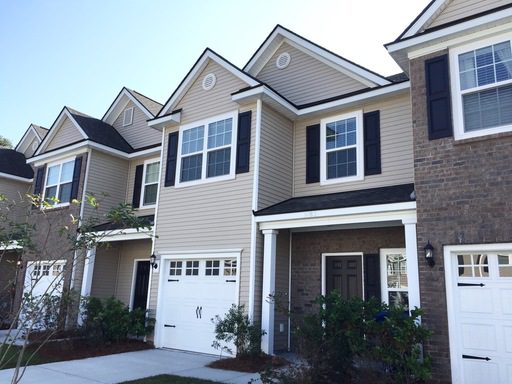 A two story cream coloured house at 1083 Bennington Drive North Charleston, SC 29492