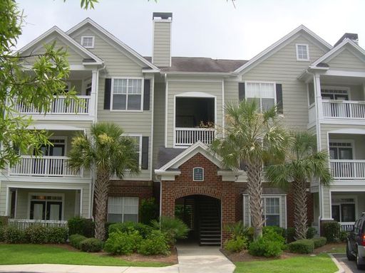 A large two story cream coloured house at 45 Sycamore Avenue, Unit 226 Charleston, SC 29407