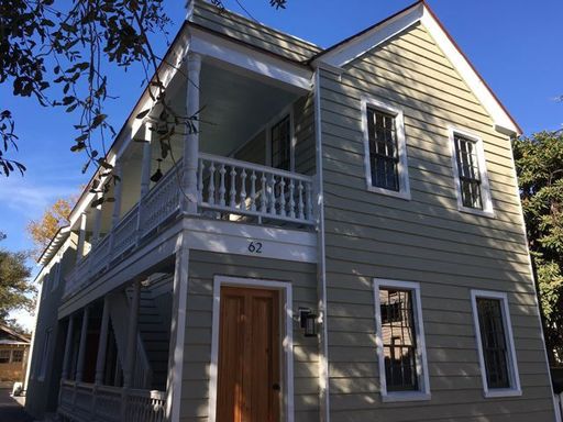 An image of yellow coloured two story house at 62 Bogard Street Unit B Charleston, SC 29403