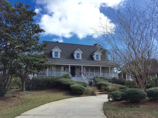 A two story black coloure house with plants in front of it at 1336 Old Brickyard Road Mount Pleasant, SC 29466