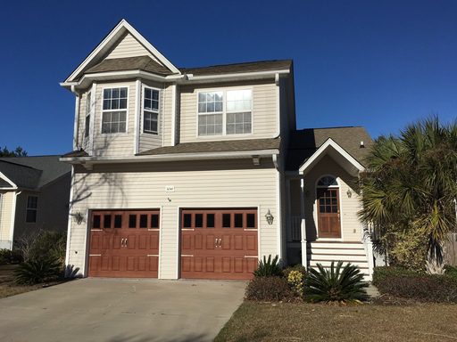 A two story yellow house at 3041 Penny Lane Johns Island, SC 29455