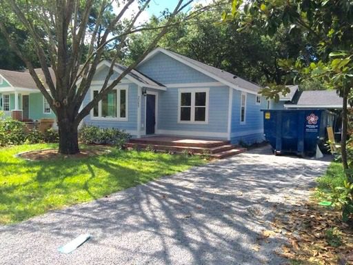 A one story blue coloured house at 907 Mockingbird Lane Charleston, SC 29414