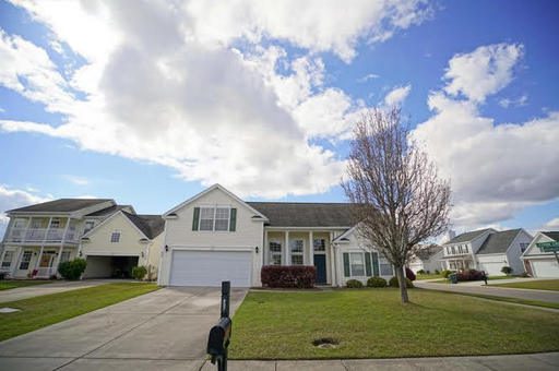 A 2350 F white coloured house with lawn in front of it at 907 Mockingbird Lane Charleston, SC 29414