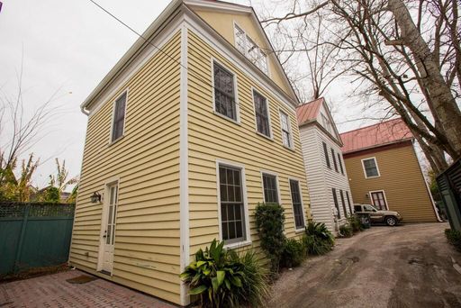 A two story house yellow coloured house at 9-B Bogard Street Charleston, SC 29403