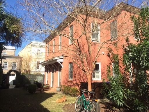 A beautiful two story red coloured house with plant front of it at 34 Krier Lane Mount Pleasant, SC 29464