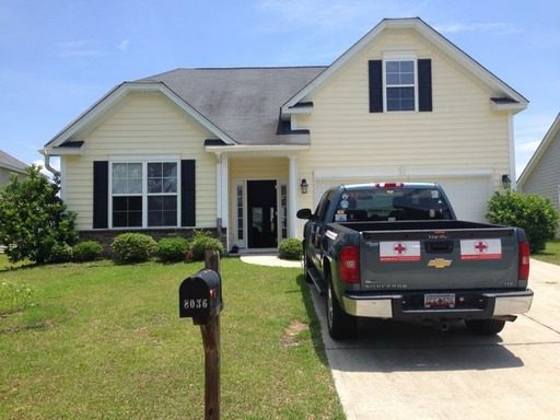 An image of a yellow coloured house with car in front if it at 8036 Hyannis Court North Charleston, SC 29420