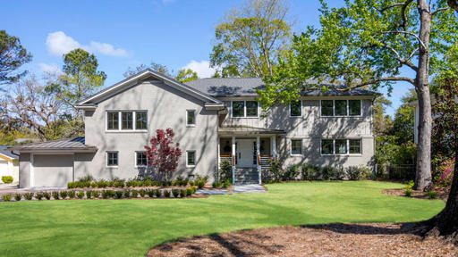 A house with large lawn in front of it at 10 Yeamans Road Charleston, SC 29407