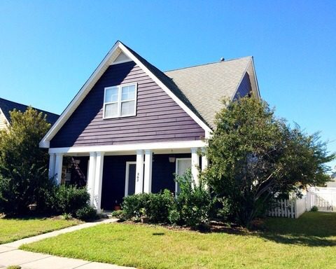 A purple coloured house with a lawn in front of it at 202 Hyacinth Street Summerville, SC 29483