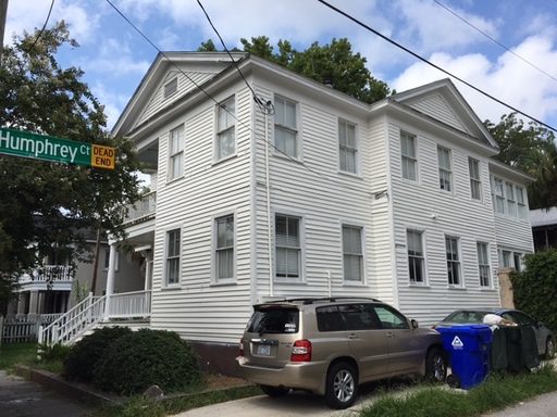 A two story house at white coloured house at 258 Rutledge Avenue Unit A Charleston, SC 29403