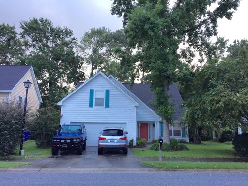 A story house with two cars in the front at 713 Lawton Harbor Drive Charleston, SC 29412