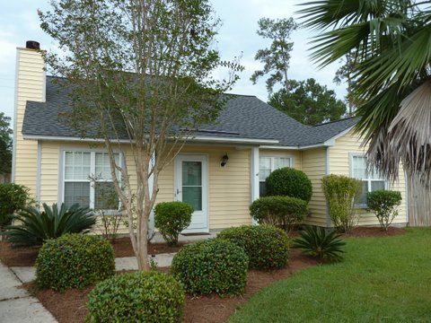 A one story yellow coloured house at 8538 Roanoke Drive North Charleston, SC 29406