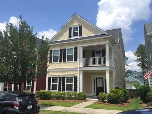 A two story yellow coloured house at 119 Musket Loop Summerville, SC 29483