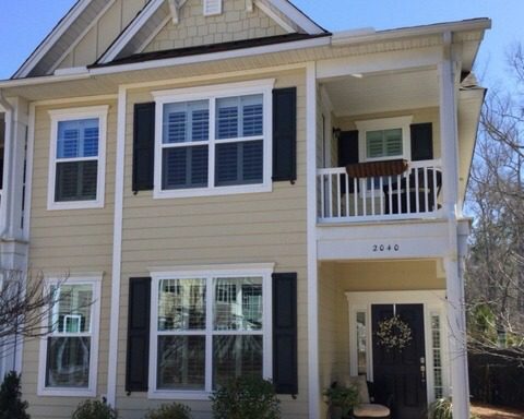A two story large yellow house at 2040 Promenade Court Mount Pleasant, SC 29466