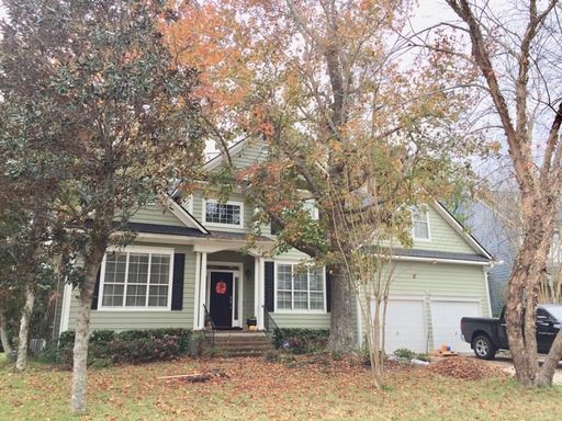 A single story house with large trees upfront at Rosedown Point Mount Pleasant, SC 29466