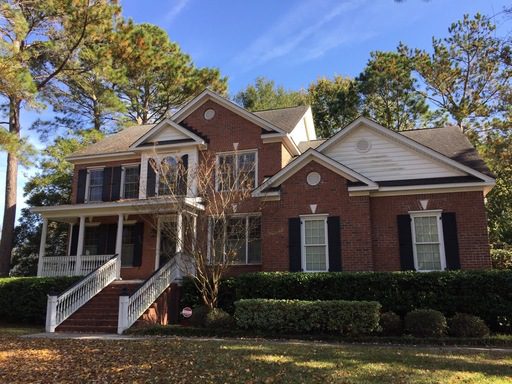 A two story large red coloured house at Whispering Marsh Drive Charleston, SC 29412