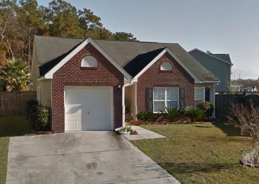 A single story red bricked house at Border Road Goose Creek, SC 29445