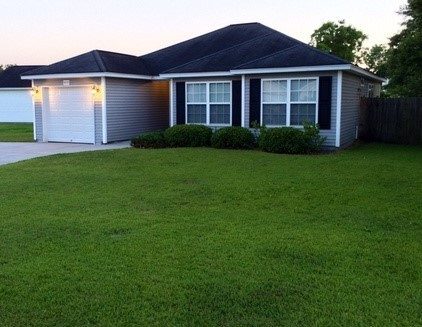 A single story house with large lawn upfront at Westview Street North Charleston, SC 29418