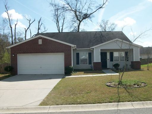 A single story house with lawn in front of it at Long Shadow Lane North Charleston, SC 29406