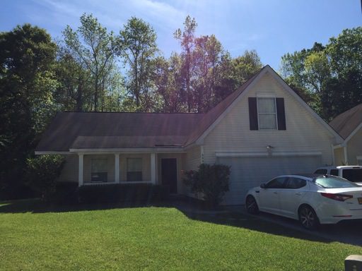 A single story house with a large green lawn upfront at Ashburton Drive Goose Creek, SC 29445