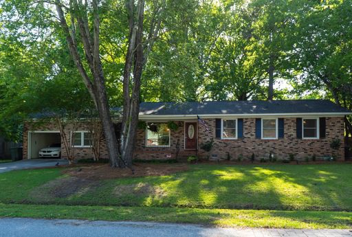 Single story house surrounded with greenery at Heathwood Drive Charleston, SC 29407