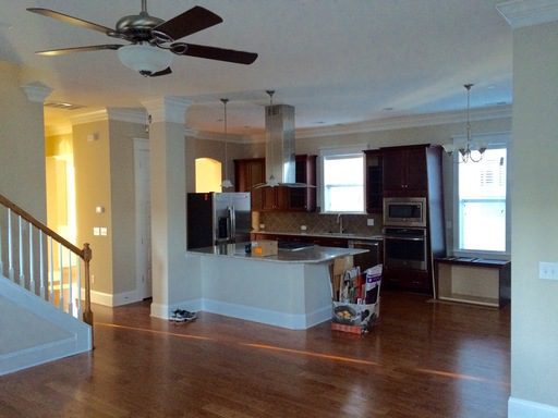 An inside image of the house with kitchen and staircase 