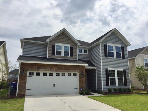 A two story house with large lawn at Wexford Court Summerville, SC 29483