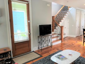 An inside image of the living room with stairs