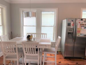 An image of the white coloured dining table