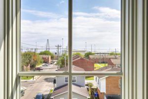 A view from the window showing lots of neighnouring houses