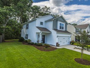 A single story house with large lawn in front of it at Indaba Way Charleston, SC 29414