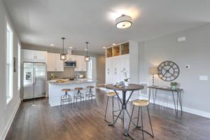 An inside image of the kitchen with a small round dining table