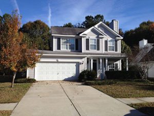 A two story white coloured house at Manorwood Lane Charleston, SC 29414