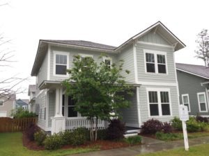 A single two story green coloured house at Warbler Way Summerville, SC 29483