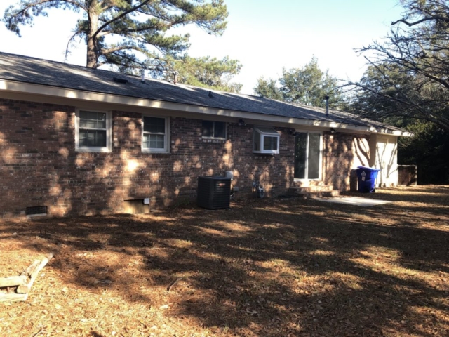 An image of the yard next to the house at 1832 Gippy Lane West Ashley Plantation