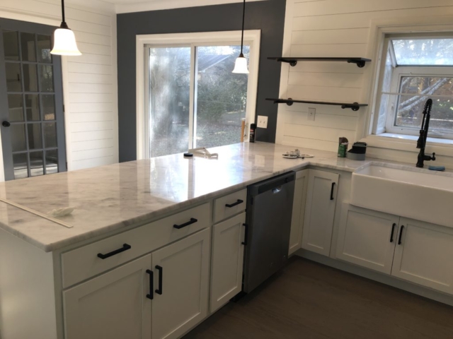 An inside image of the house showing white cabinets