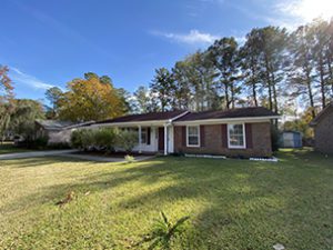 A single story house with large lawn upfront at Reynard Drive Goose Creek, SC 29445 