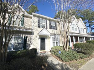 A two story white townhouse at Pond Pine Trail Summerville, SC 29483