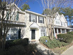 A two story white townhouse at Pond Pine Trail Summerville, SC 29483