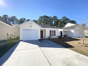 A single story white coloured house at Coosawatchie Street Summerville, SC 29485