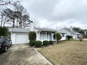 A single story white coloured house with lawn upfront at Laurel Ridge Road North Charleston, SC 29418 