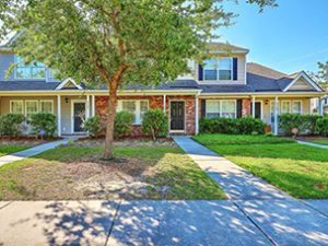 A single story house with large tree at Poplar Grove Place Summerville, SC 29483 with large tree