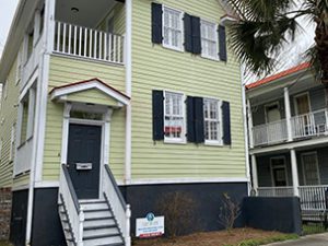 A two story green coloured house at Smith Street Charleston, SC 29403