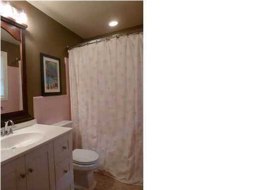 An inside image of bathroom showing bathroom curtain