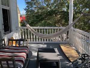 An image of the balcony with sofas in apartment at 30 Mary Street, Unit 4 Charleston, SC 29403