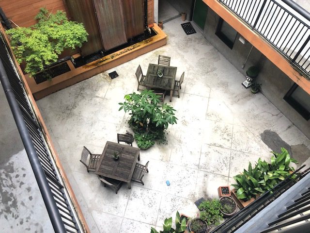 An aerial view of the sitting area in the porch of the building