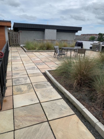 An image of the sitting area with outdoor grill on the terrace